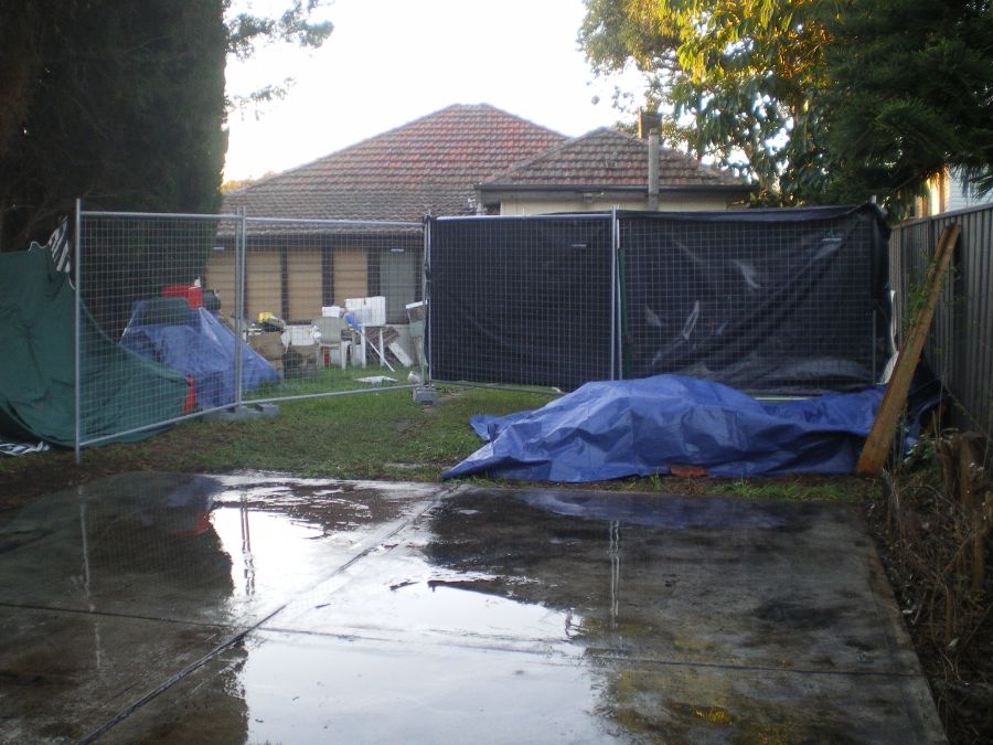 Safe asbestos removal and demolition of entire garage down to the slab level