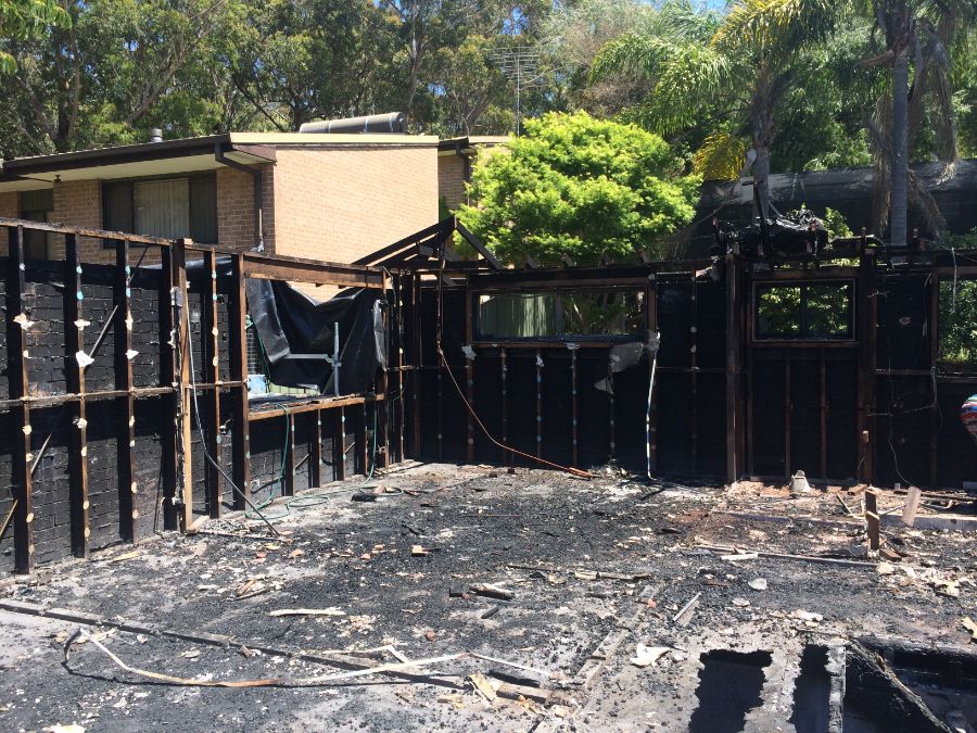 Careful demolition of fire damaged house